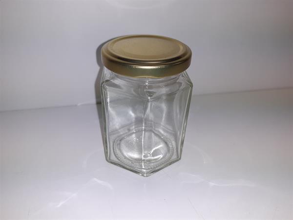 Seks-kantet glas med guldfarvet låg, 190 ml